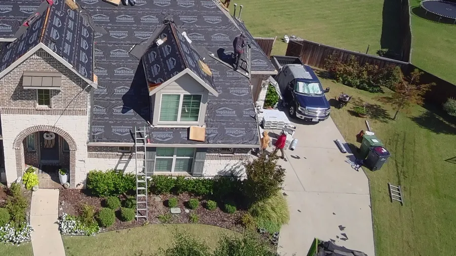 Detail: the dormers and front of the same house under synthetic underlayment